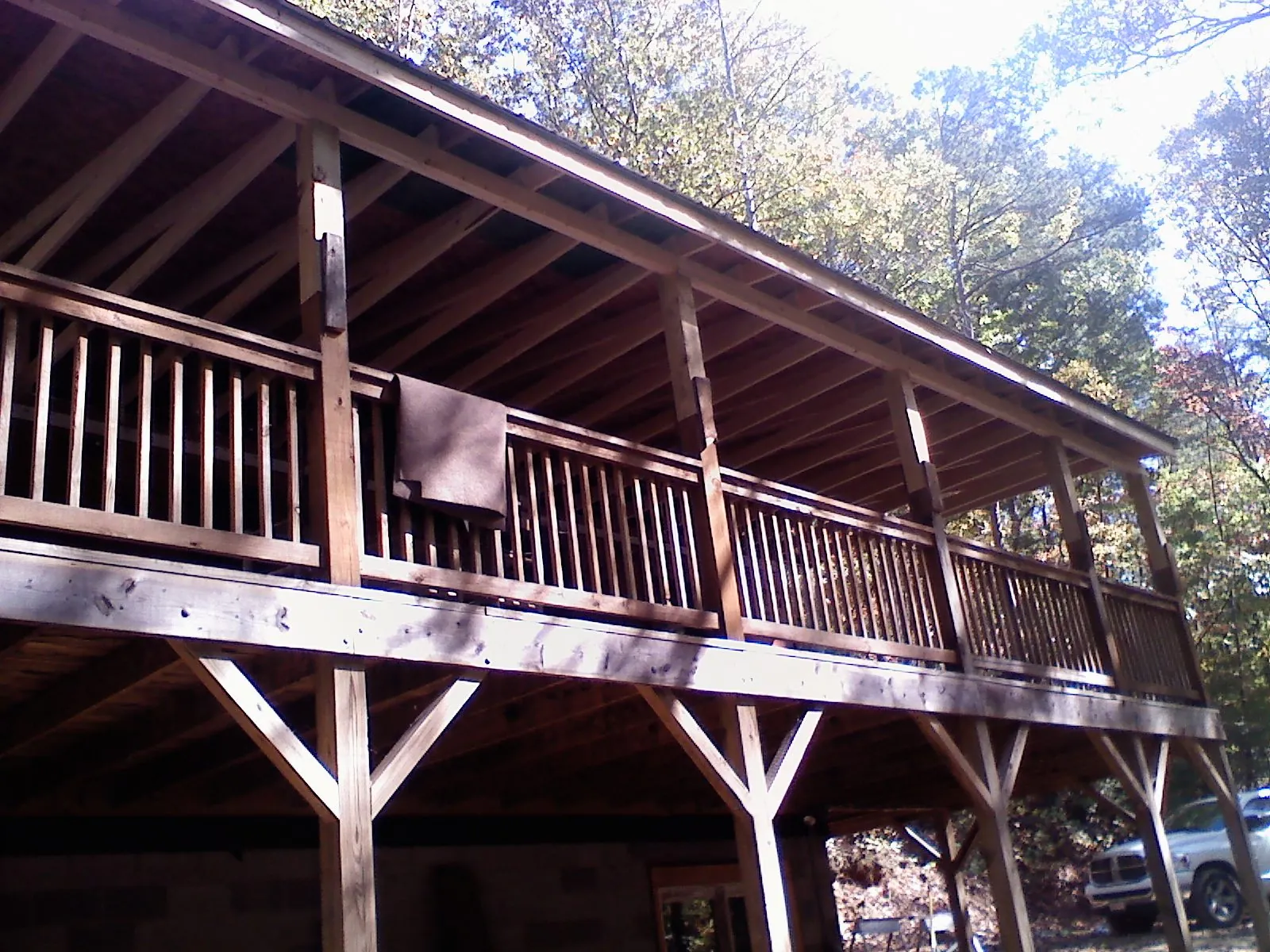 Timber framing under a new elevated porch and deck in Lyndonville